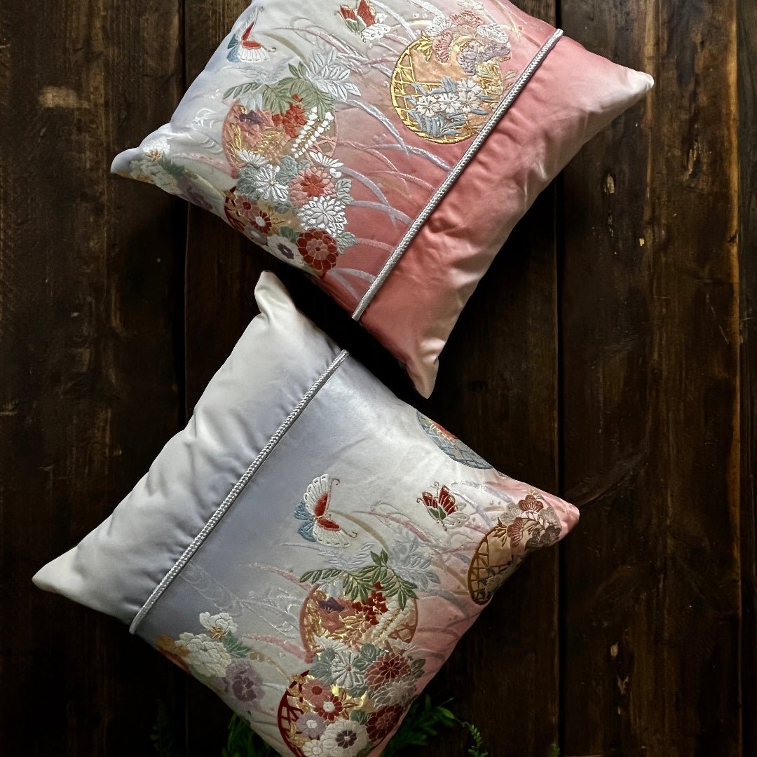 Front of Obi cushions. Pink to violet ombre with butterfly and flower motifs symbolic of transformation and new beginnings.