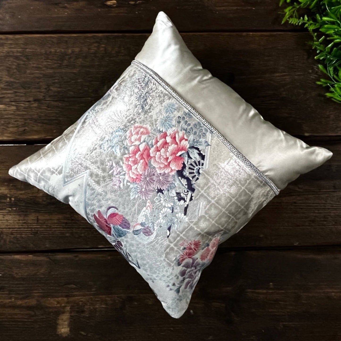 Single cushion handcrafted from reclaimed Obi. Ivory silk, pink, blue and violet, with silver metallic threads.