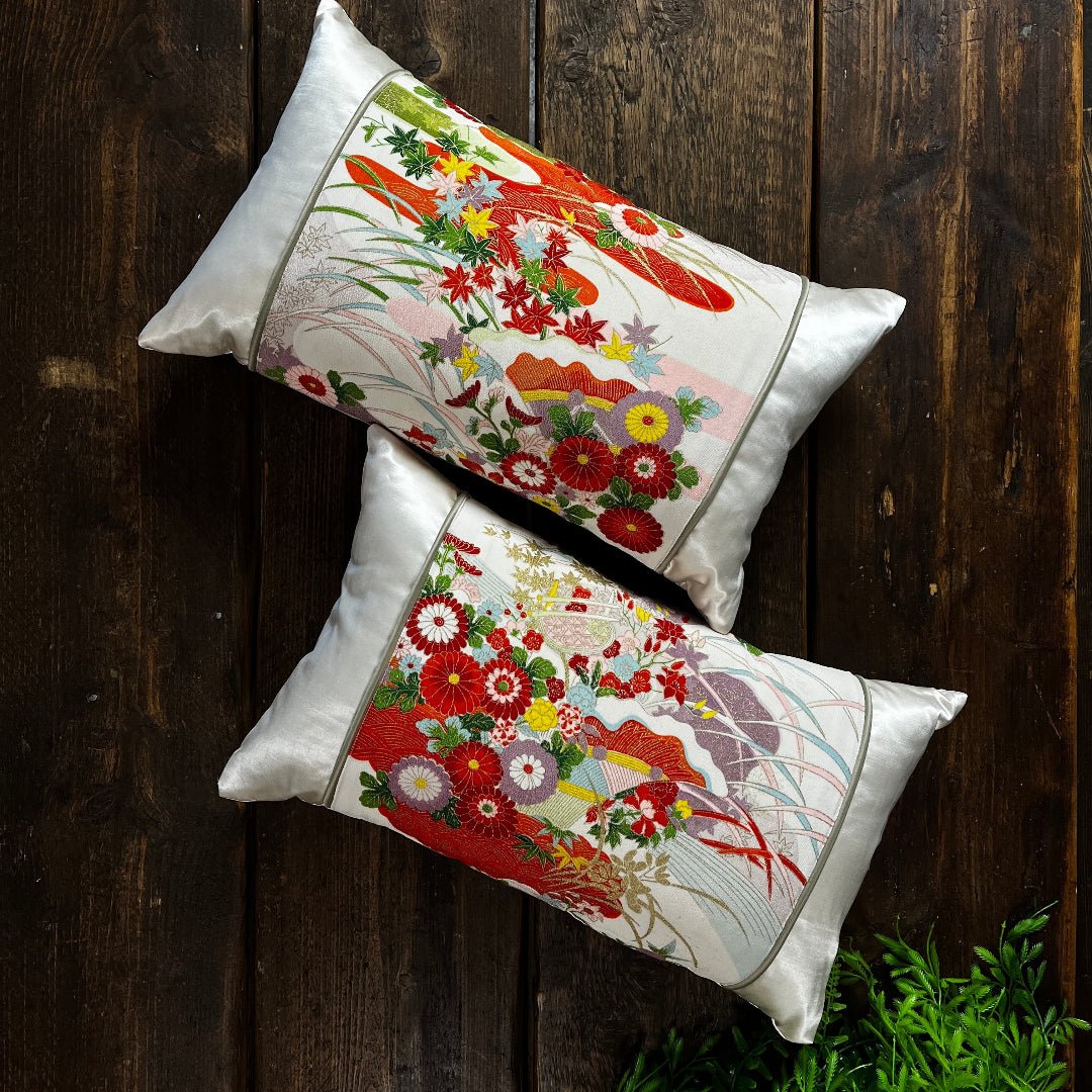 Pair of bolster cushions. Made from sustainable silk. Luxurious and colour design on ivory silk.