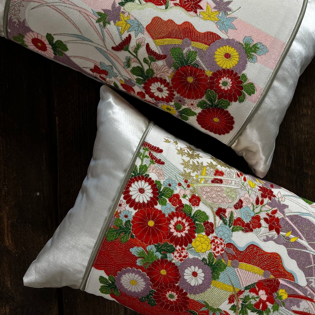 Pair of bolster cushions. Made from sustainable silk. Luxurious and colour design on ivory silk.
