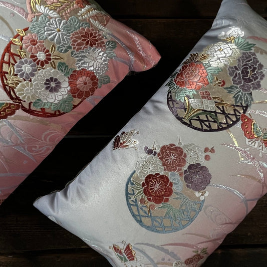 Pair bolster cushions sustainably handmade from reclaimed silk obi.