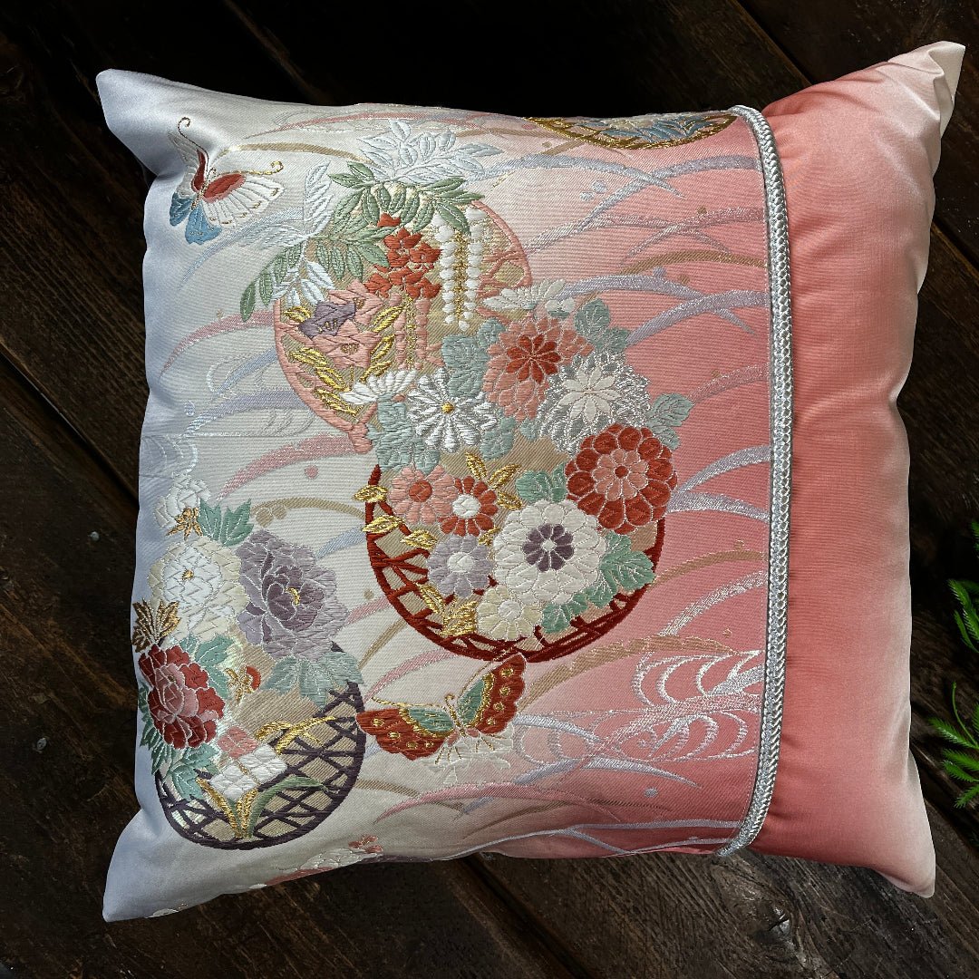 Silk cushion with Butterfly and flower motifs representing transformation and new beginnings.