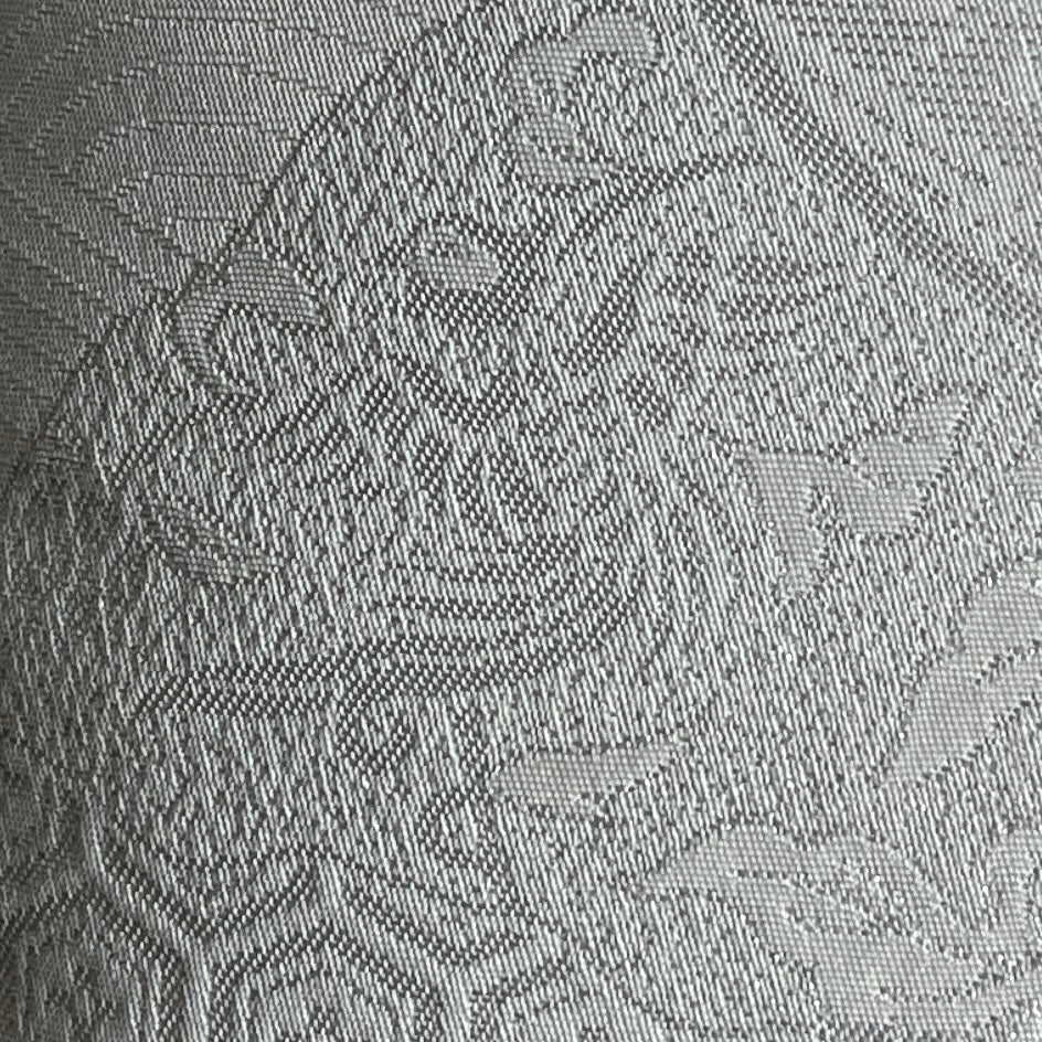 detailed close up of silver on white motif of good luck flying phoenix cushion