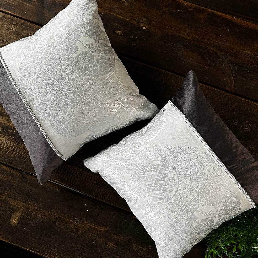 Pair of cushions.  Handmade sustainably from white and metallic silver silk reclaimed Obi.